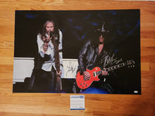 Load image into Gallery viewer, Aerosmith Steven Tyler Guns N Roses Slash Autographed 24x36 Framed Canvas ACOA
